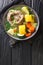 Caldo de resÂ is a traditional Mexican beef soup made with beef chunks and vegetables closeup in the plate. Vertical top view